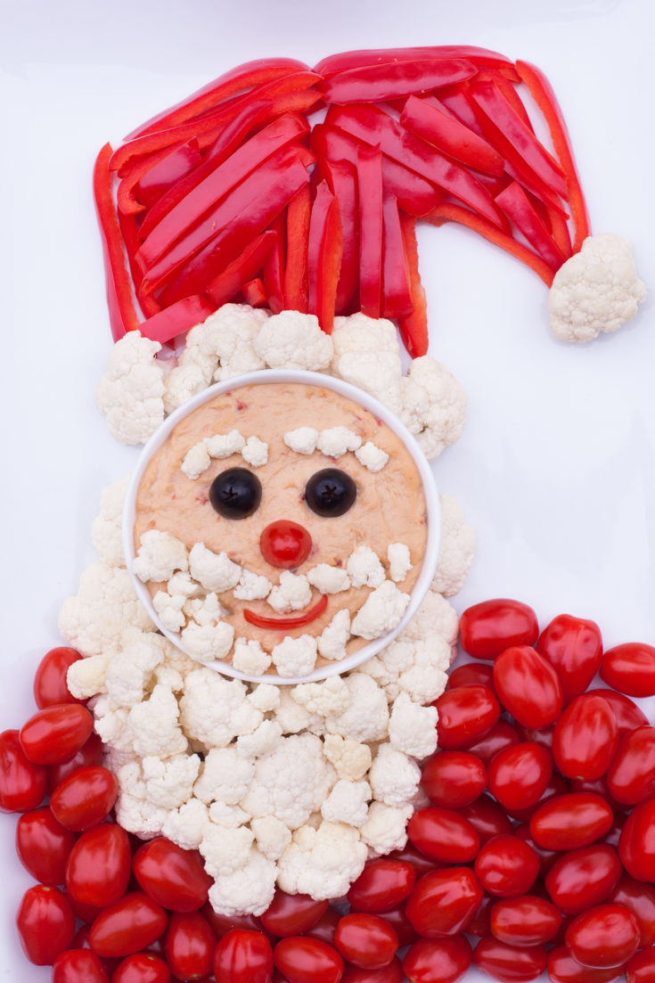 This cute Santa veggie tray is a magical way to bring some healthy options to your Christmas table. From EatingRichly.com
